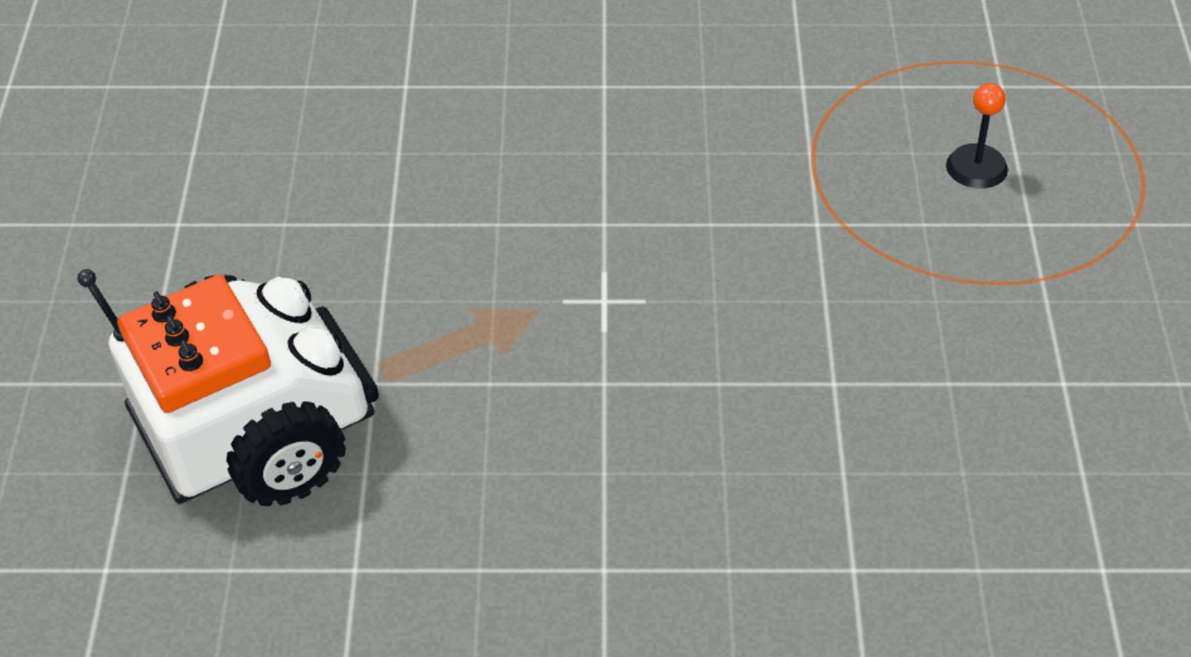 The little robot on its test bay, driving itself toward an orange target.